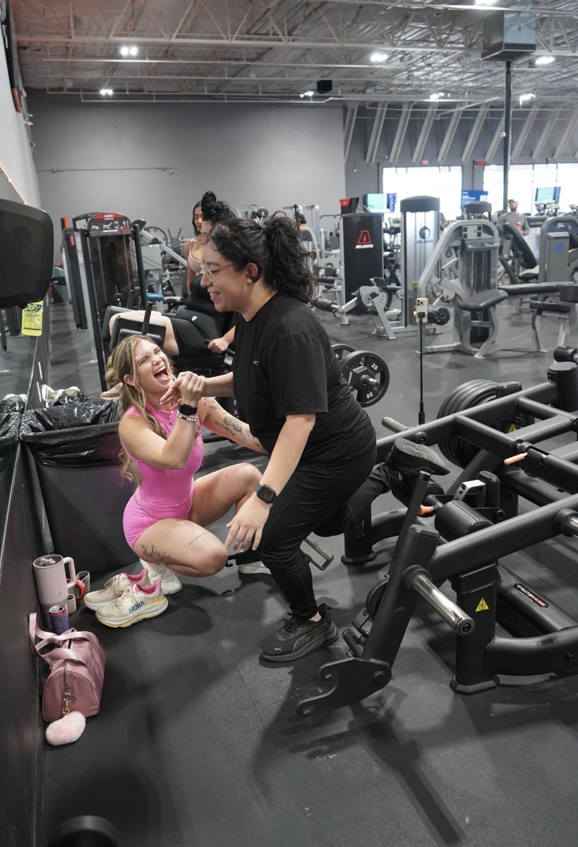 Sami cheering on a retreat guest during a gym session