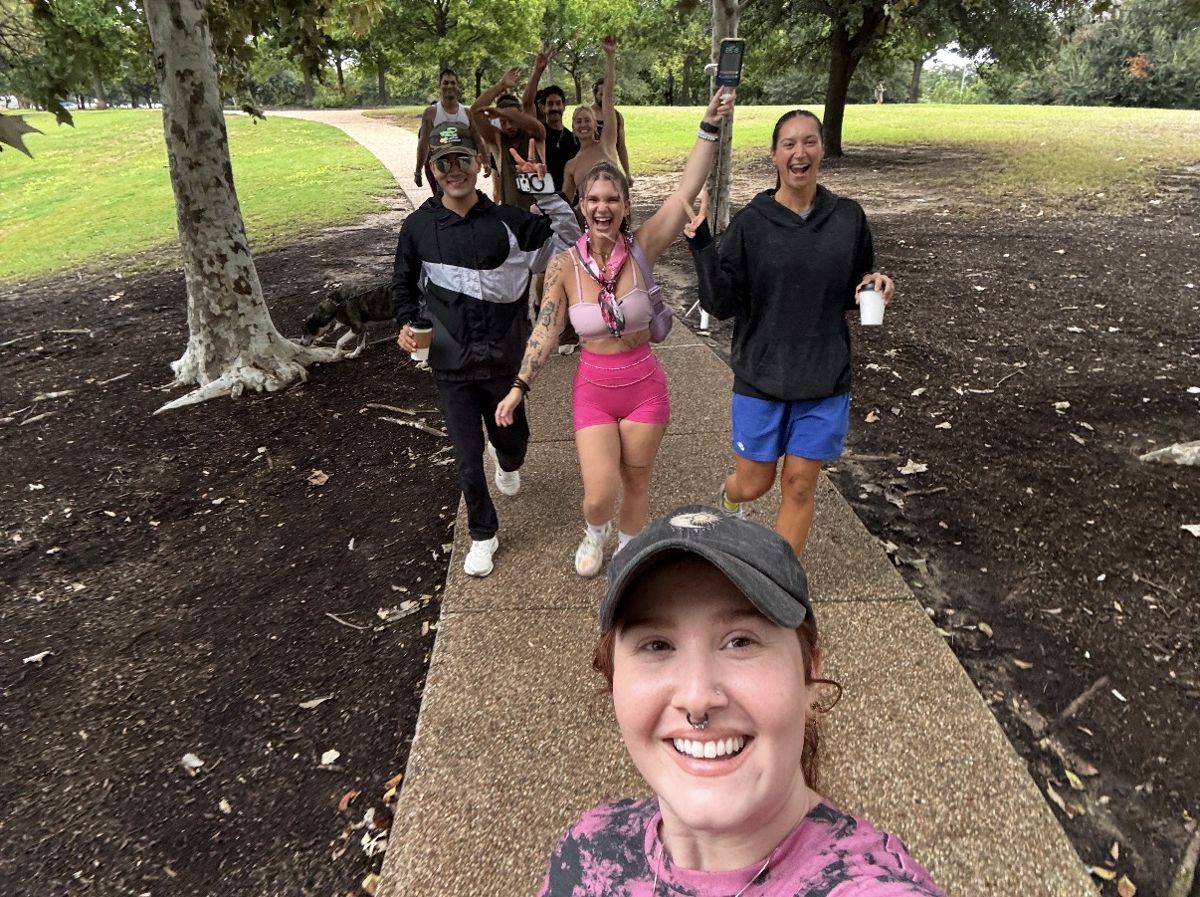 Walkers cheering as they walk the park path
