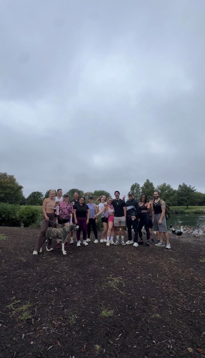 The walk group posing by the lake at Mueller